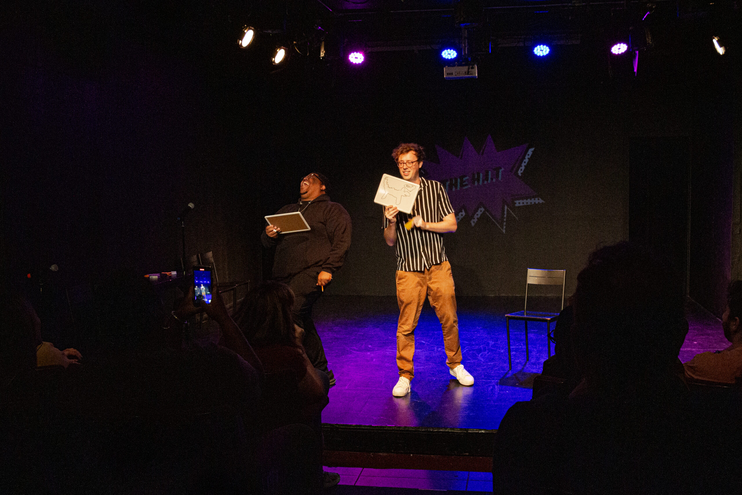 Dan Titmuss performing magic on stage