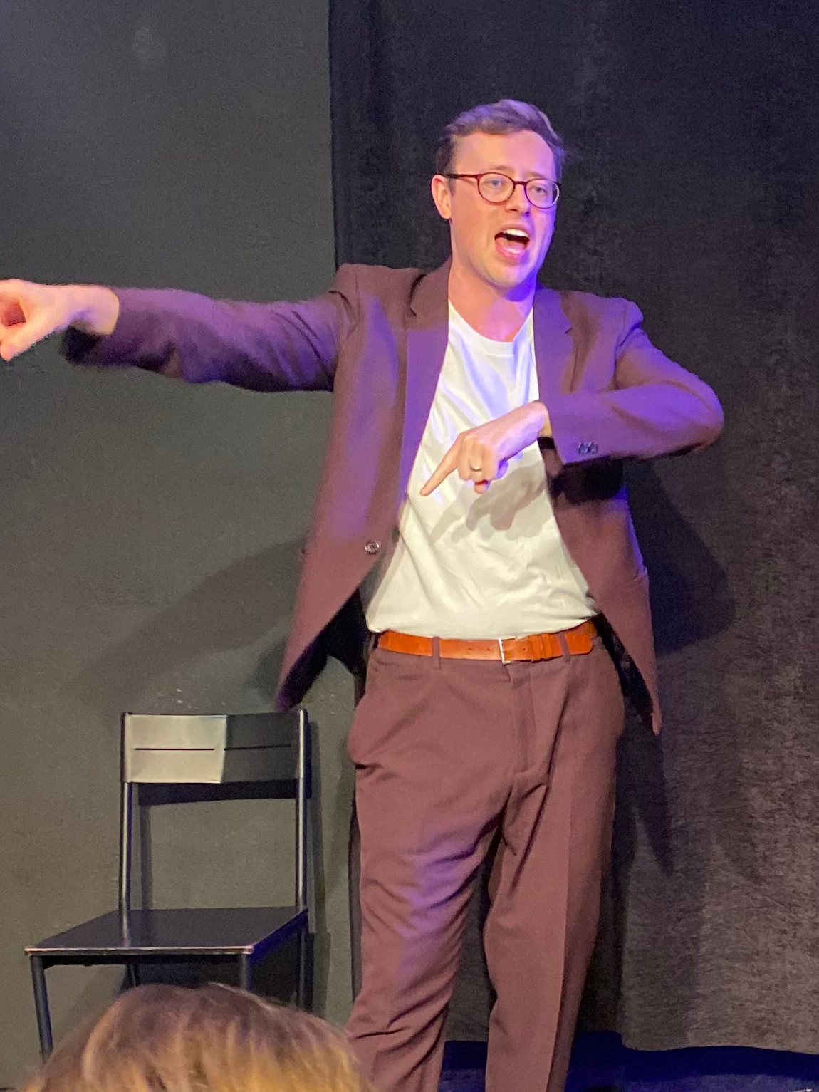 Dan Titmuss performing on stage